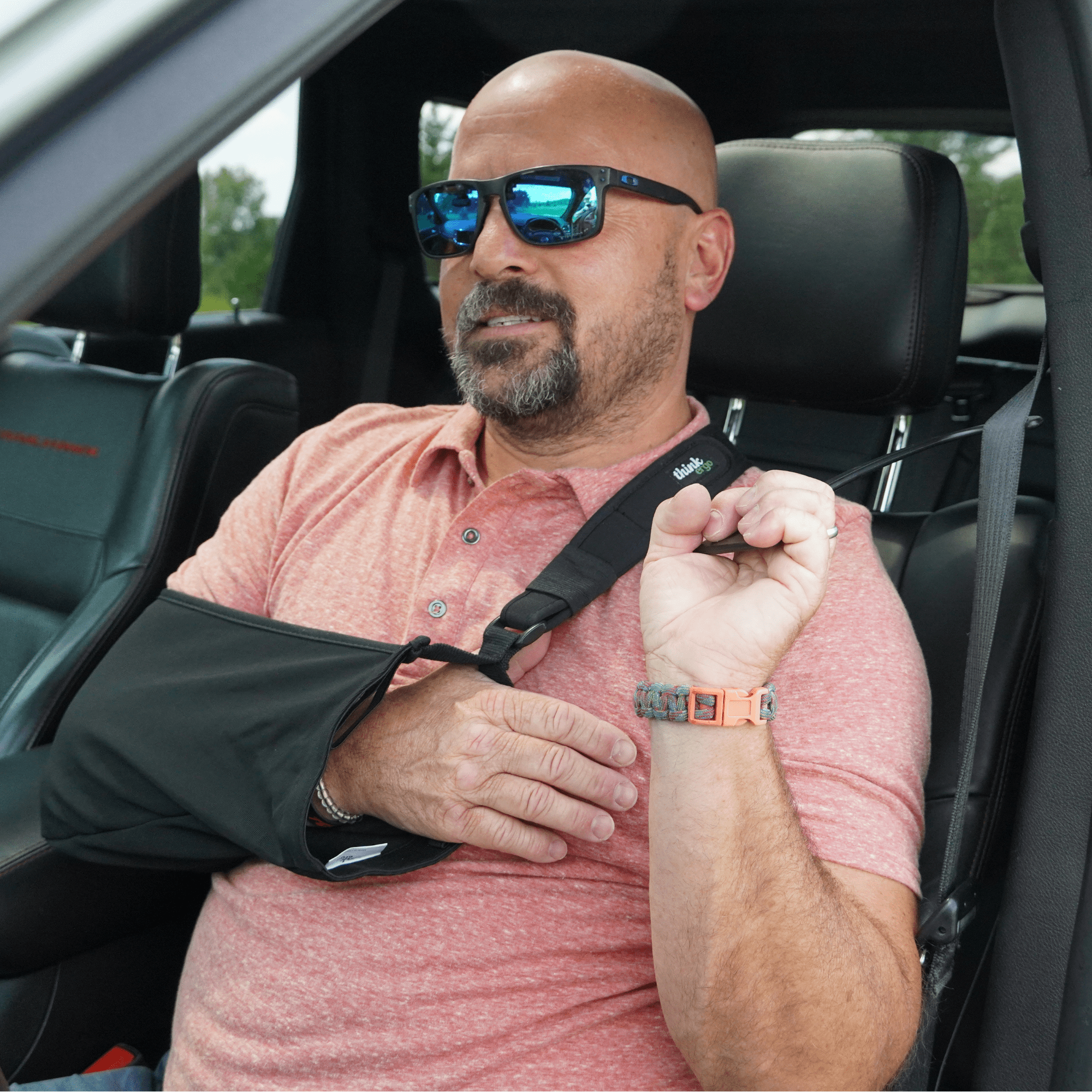 using seatbelt catcher with arm in sling